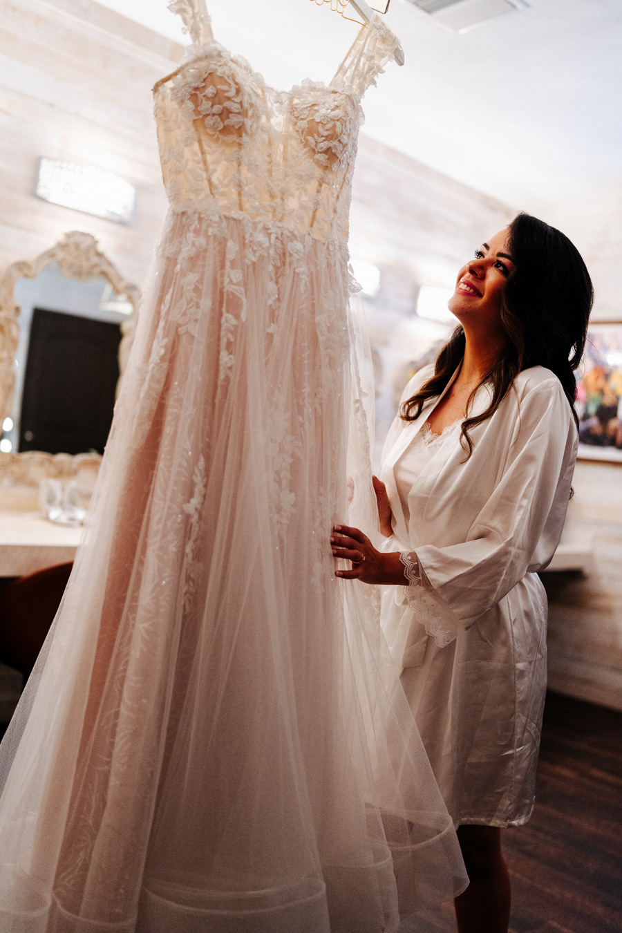 Bride looking at her wedding dress